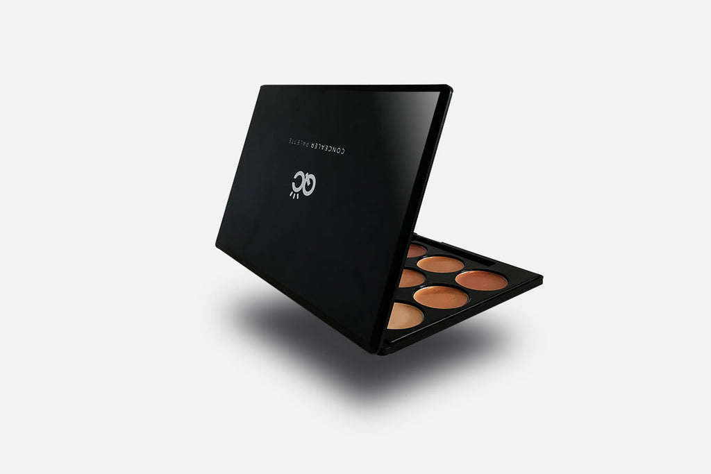 Makeup palette with brown shades on a white background