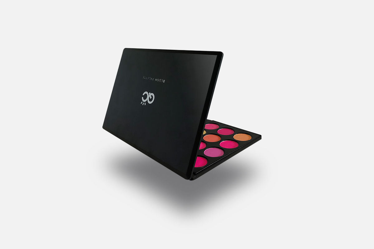 Black makeup palette with colorful dots on a white background