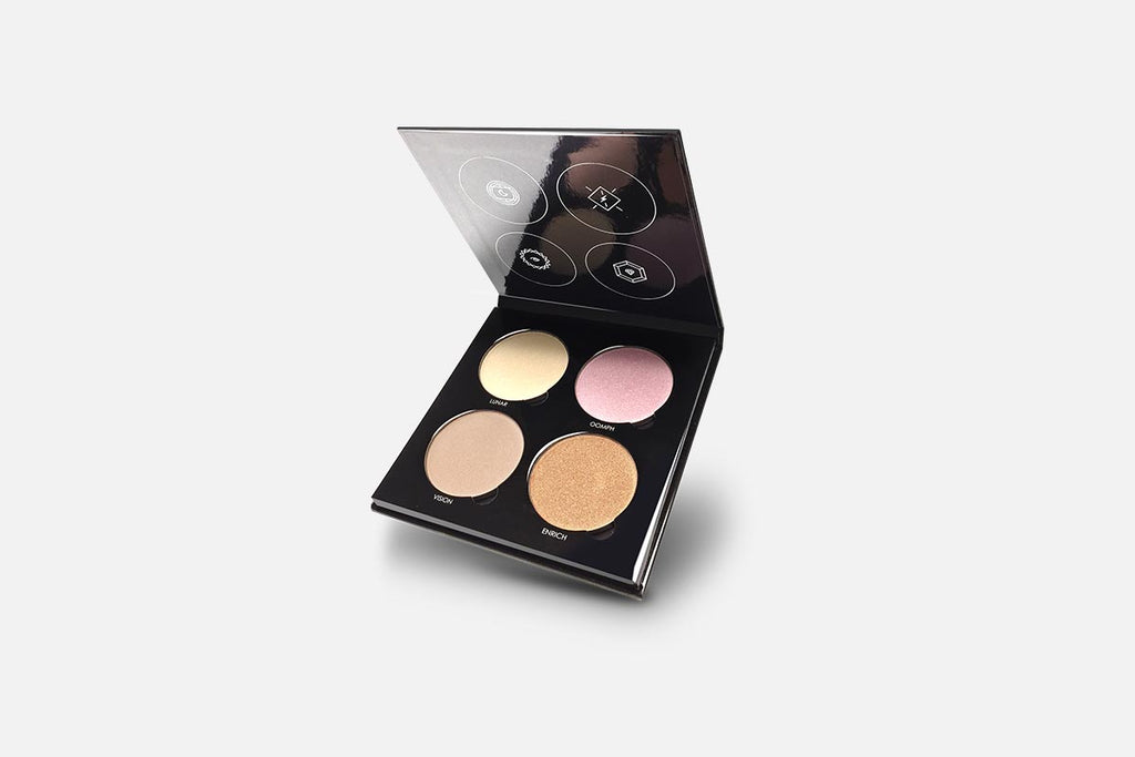 Makeup palette with four colors on a light gray background