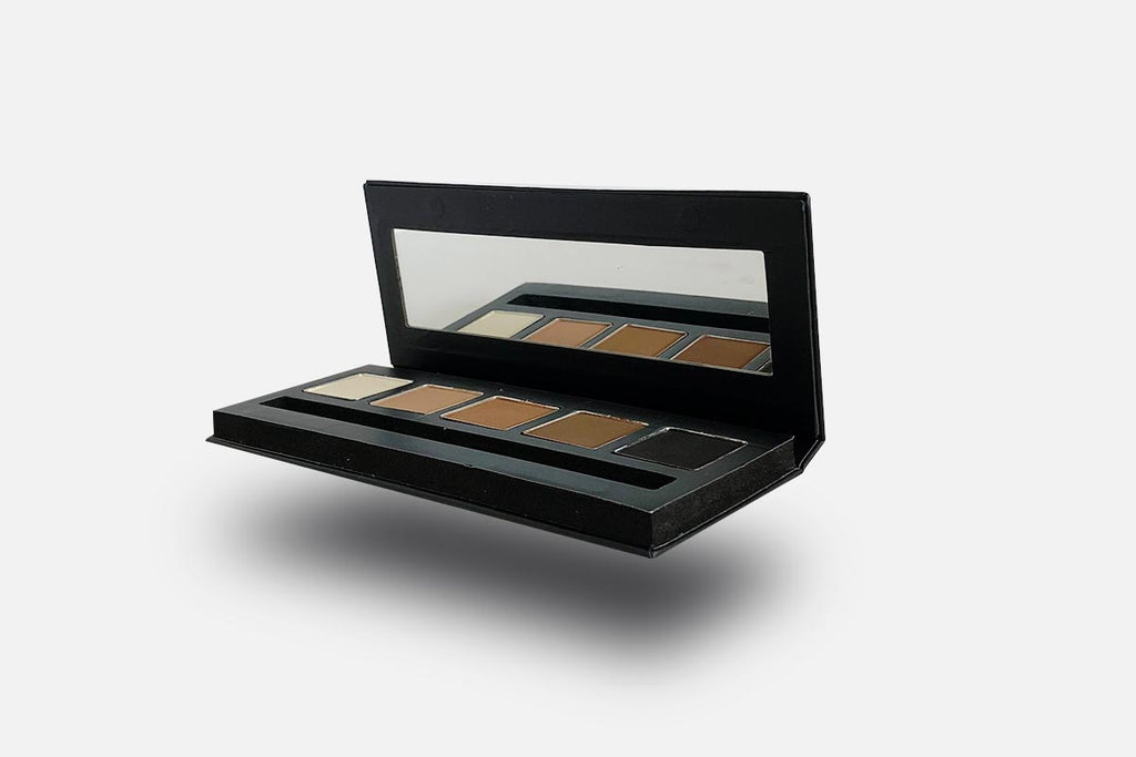 Makeup palette with shades of brown and black on a white background