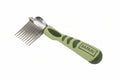 Green grooming comb with metal teeth on a white background, branded 'Safari'.