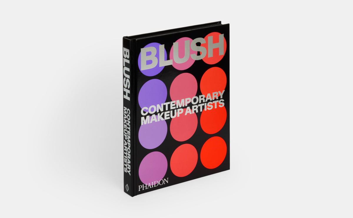 Book titled 'Blush: Contemporary Makeup Artists' with colorful cover design on a white background