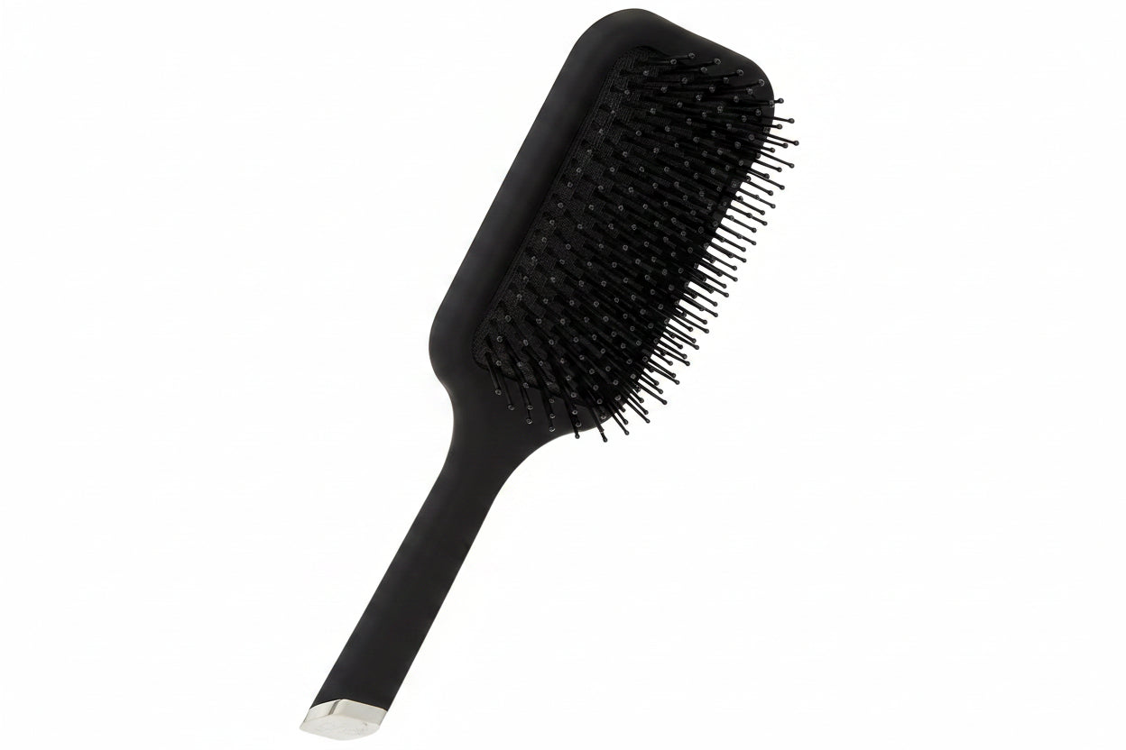 Black hairbrush with silver end on a white background