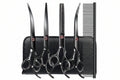 Set of black hairdressing scissors and a comb on a white background