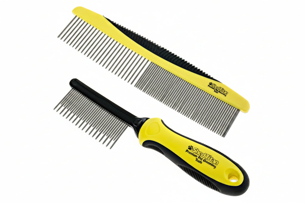 Two yellow and black pet grooming combs shown on a plain white background, one lying flat and one angled diagonally. The combs have fine metal teeth and visible branding that reads PetSmart.