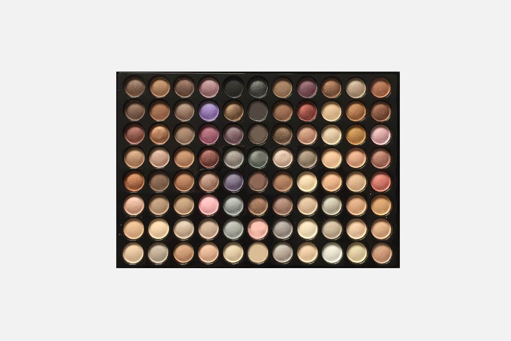 Makeup palette with various colors on a white background