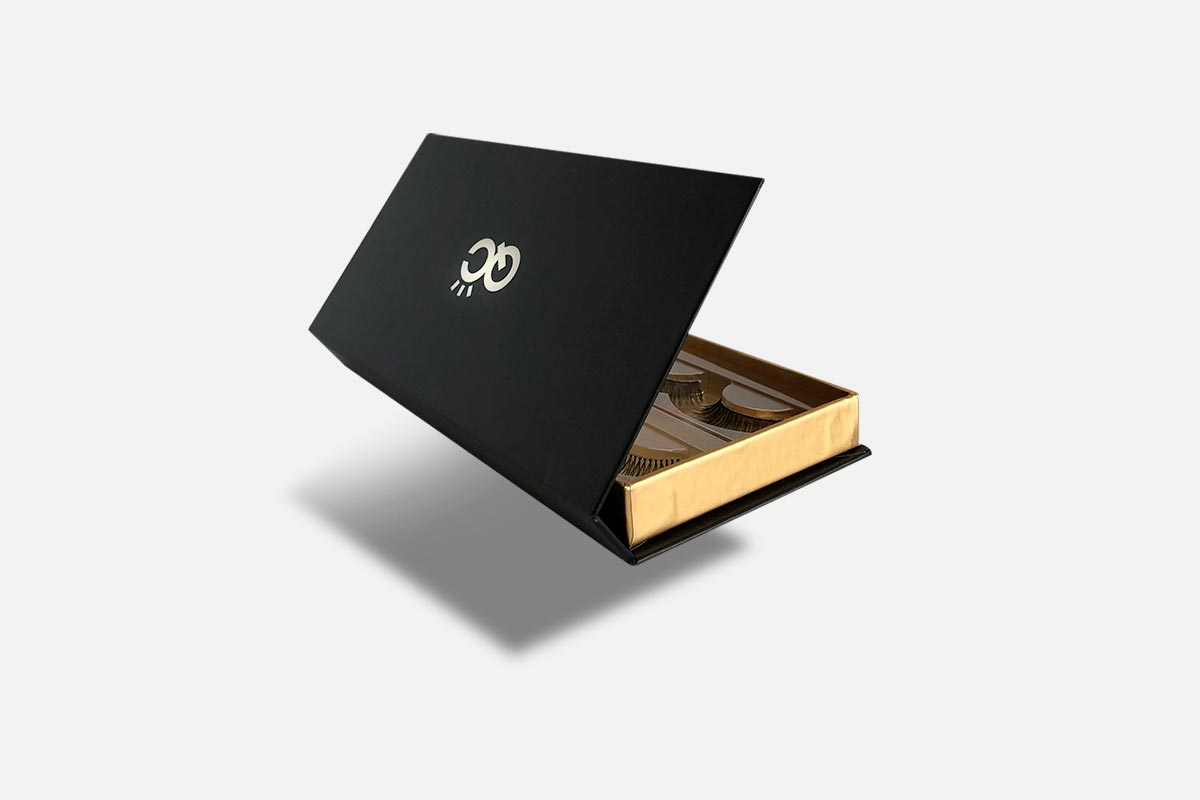 Black and gold box with a logo on a white background