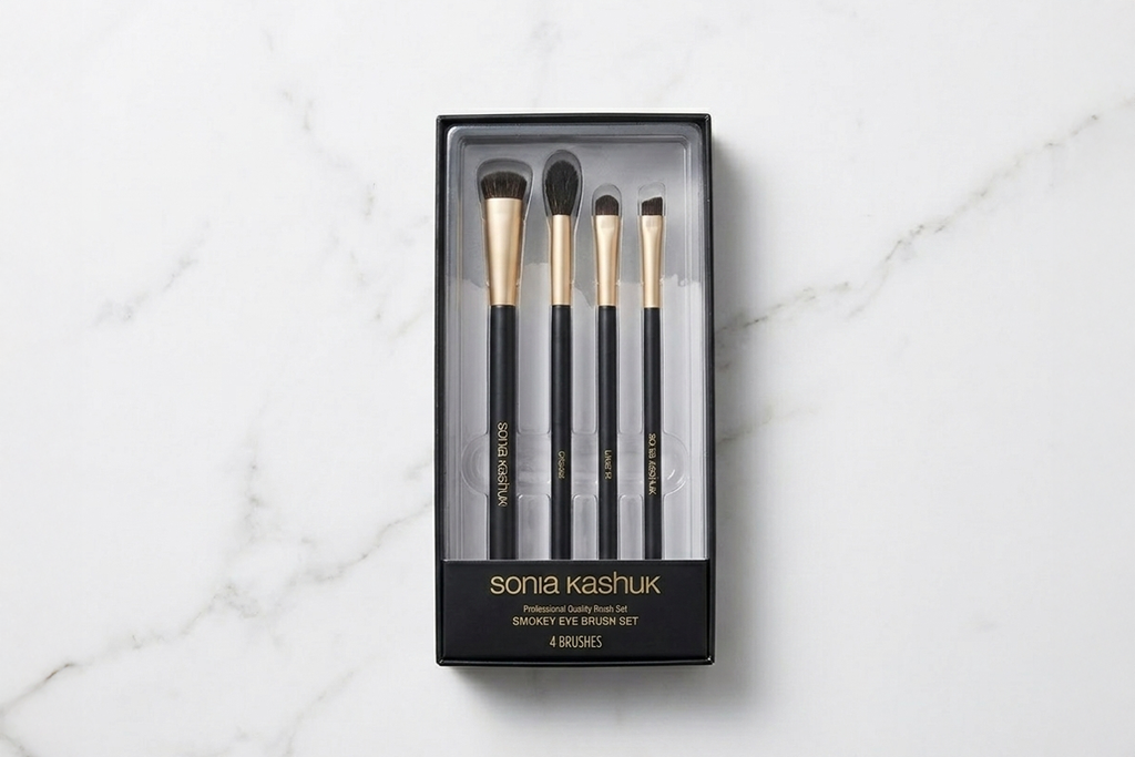 Set of Sonia Kashuk makeup brushes in packaging on a marble surface