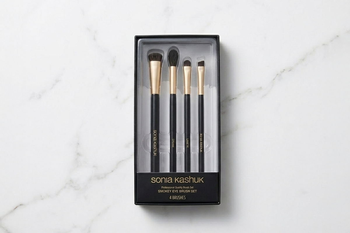 Set of Sonia Kashuk makeup brushes in packaging on a marble surface