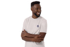 Man wearing a white t-shirt with a QC logo on a white background