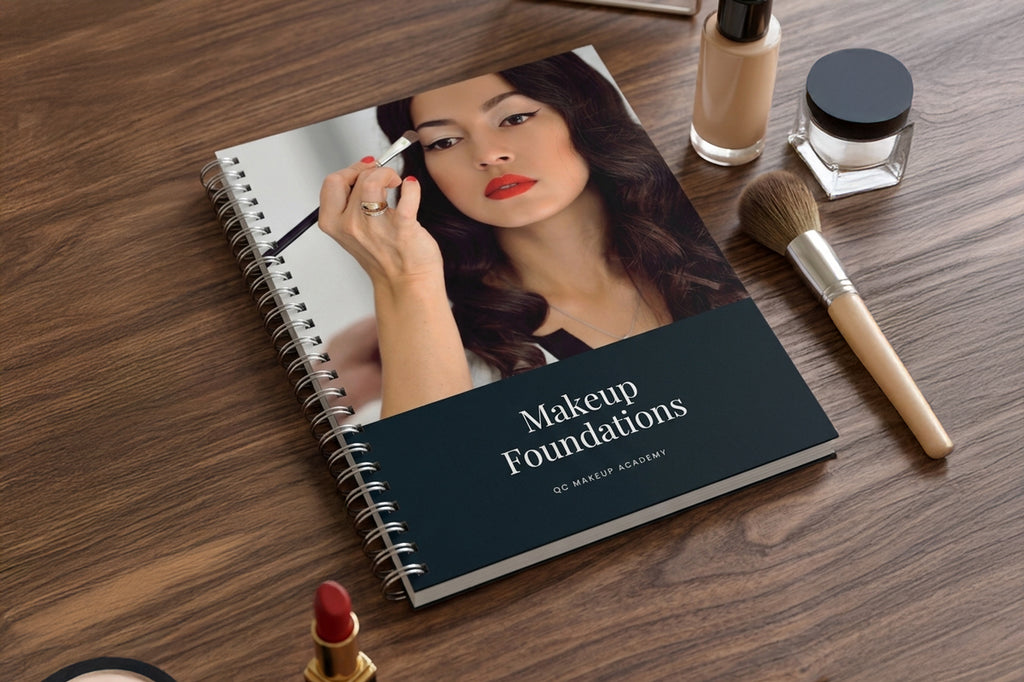 Makeup Foundations book with a woman applying makeup on a wooden surface