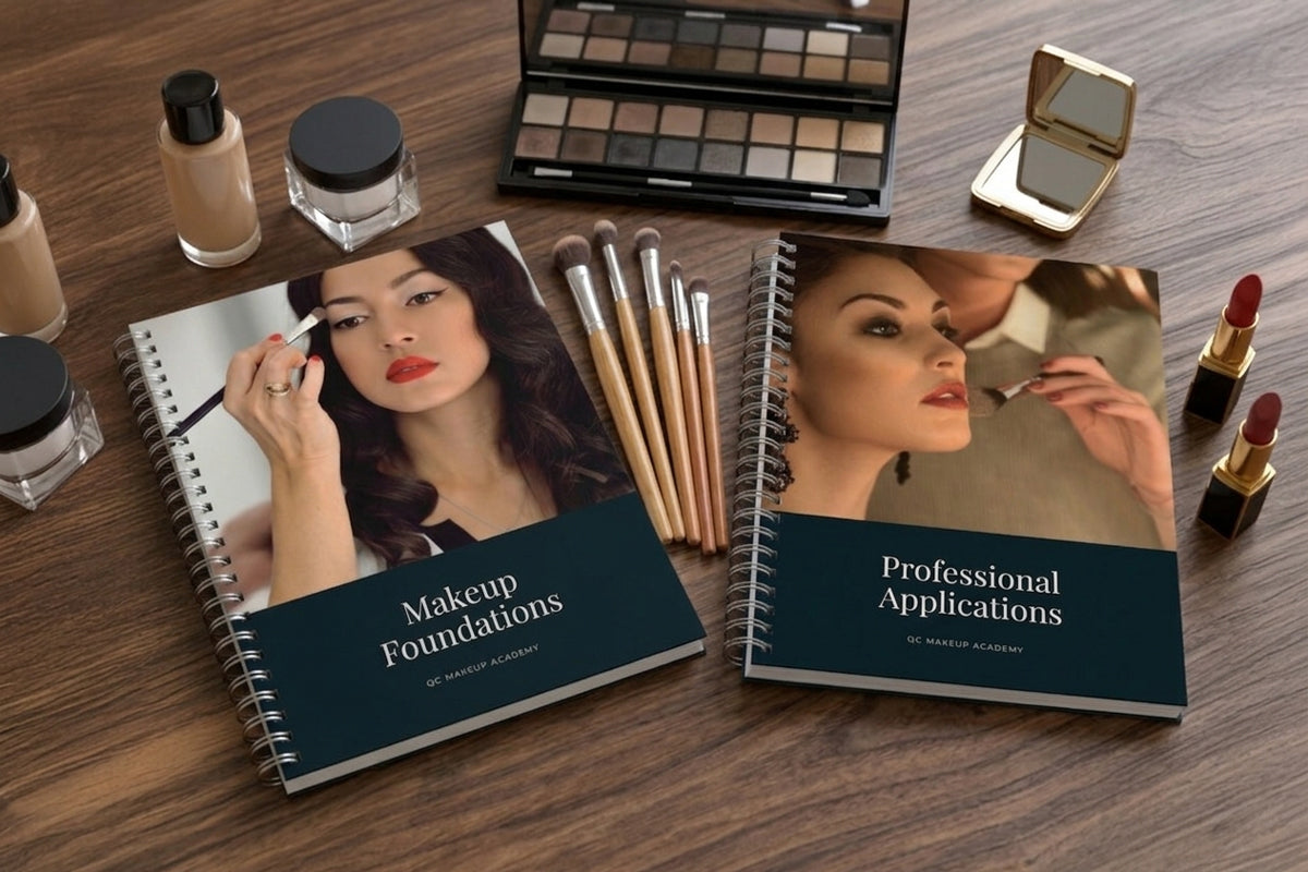 Makeup products and books on a wooden surface