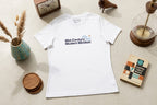 White t-shirt with 'Mid-Century Modern Mindset' text on a light surface with decorative items.