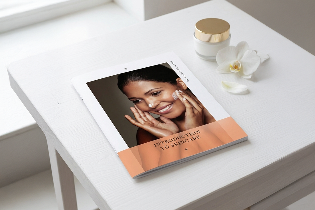 Skincare book on a table with cream and flower