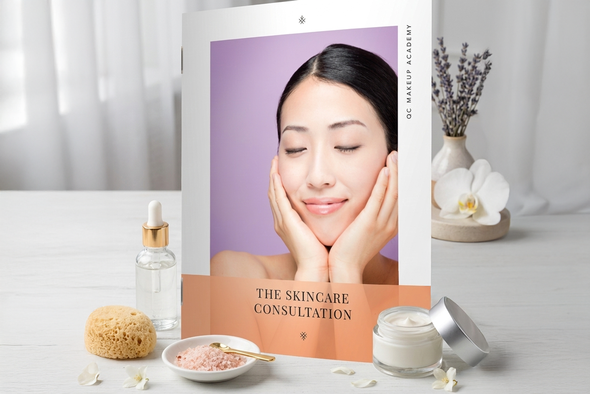 Skincare consultation book with a woman's face on the cover, surrounded by skincare products on a table.