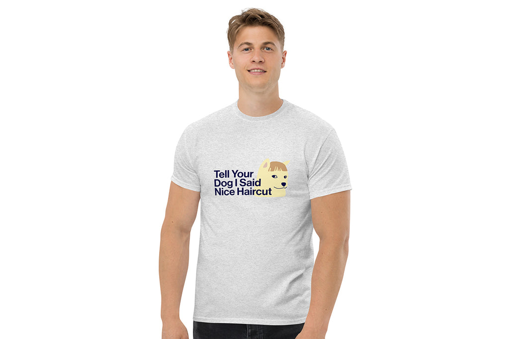 Person wearing a gray t-shirt with humorous text and graphic design on a white background