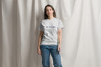 Person wearing a gray t-shirt with QC Pet Studies Logo on a plain background