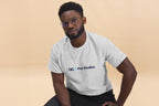 Man wearing a gray t-shirt with 'QC Pet Studies' logo on a beige background