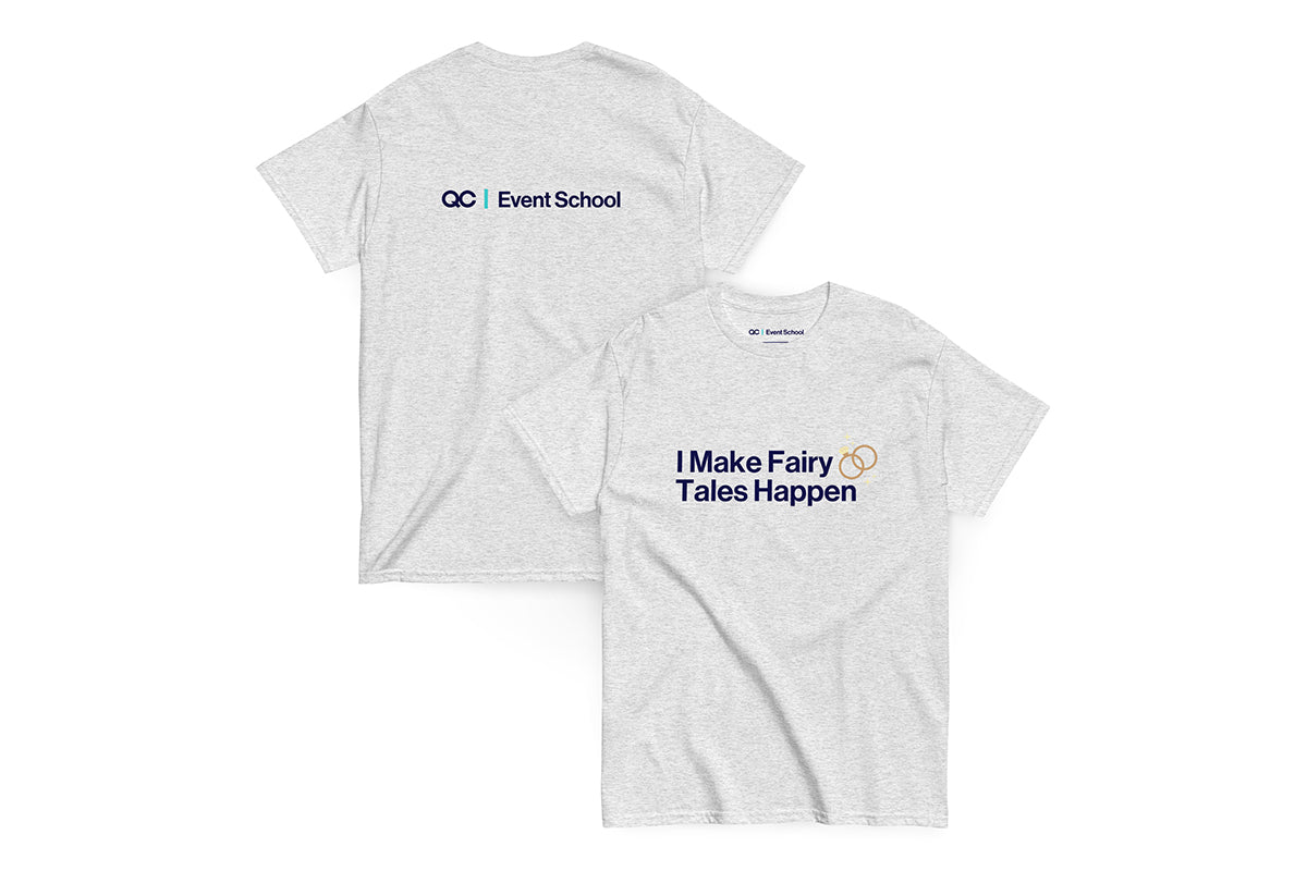 Back and front of grey t-shirt. Back reads "QC Event School". Front reads "I Make Fairy Tales Happen"