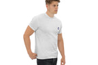 Person wearing a gray t-shirt with a small Q logo on a white background