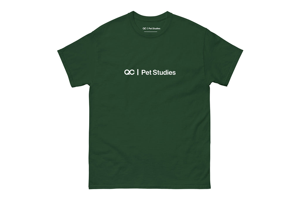Green t-shirt with 'QC Pet Studies' text on a white background