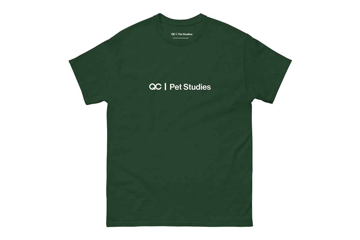 Green t-shirt with 'QC Pet Studies' text on a white background