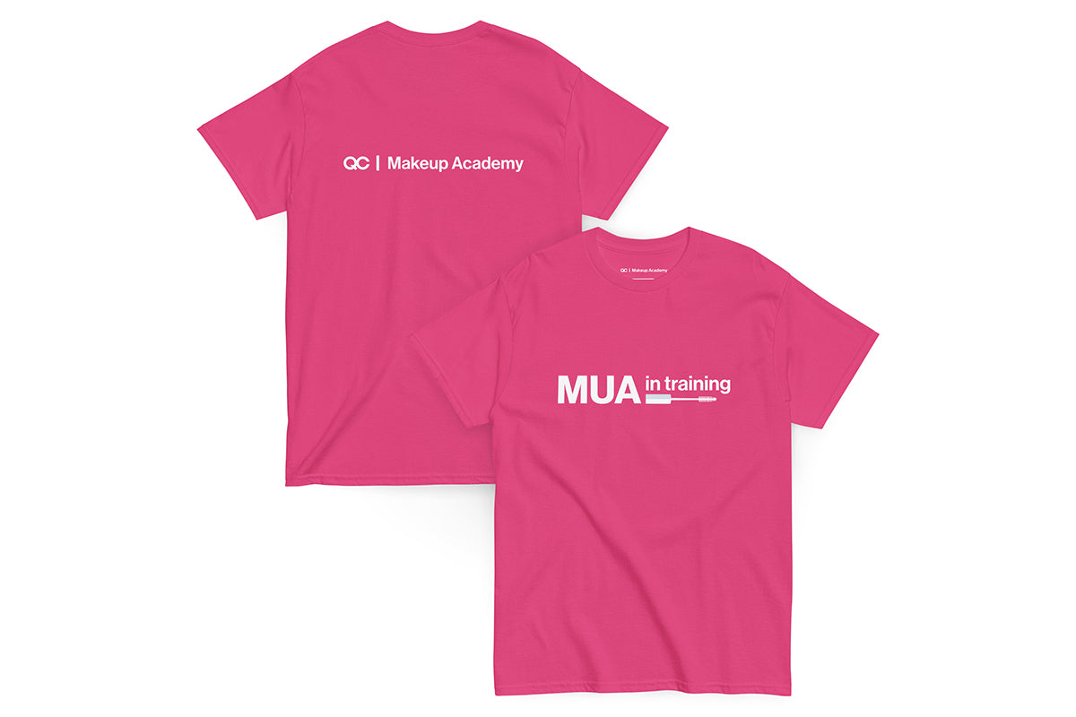 Pink t-shirt with text 'MUA in Training' on a white background. Back of t-shirt reads "QC Makeup Academy".