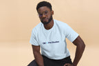 Man wearing a light blue t-shirt with 'QC Pet Studies' text on a beige background