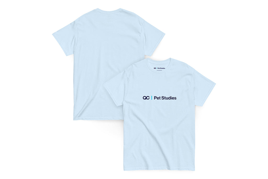 Light blue t-shirt with 'QC Pet Studies' logo on a white background