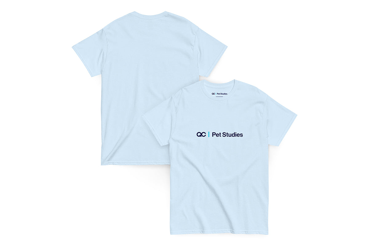 Light blue t-shirt with 'QC Pet Studies' logo on a white background