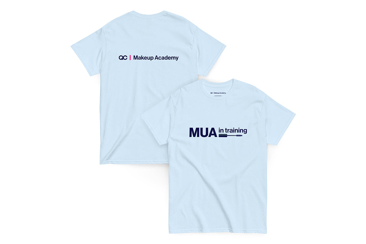 Back and front of blue t-shirt. Back reads "QC Makeup Academy", front reads "MUA in Training"