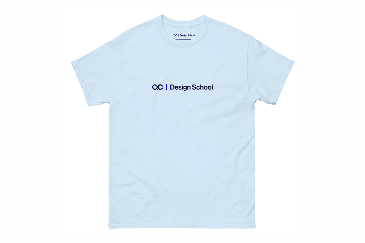 Light blue t-shirt with 'QC Design School' logo on a white background
