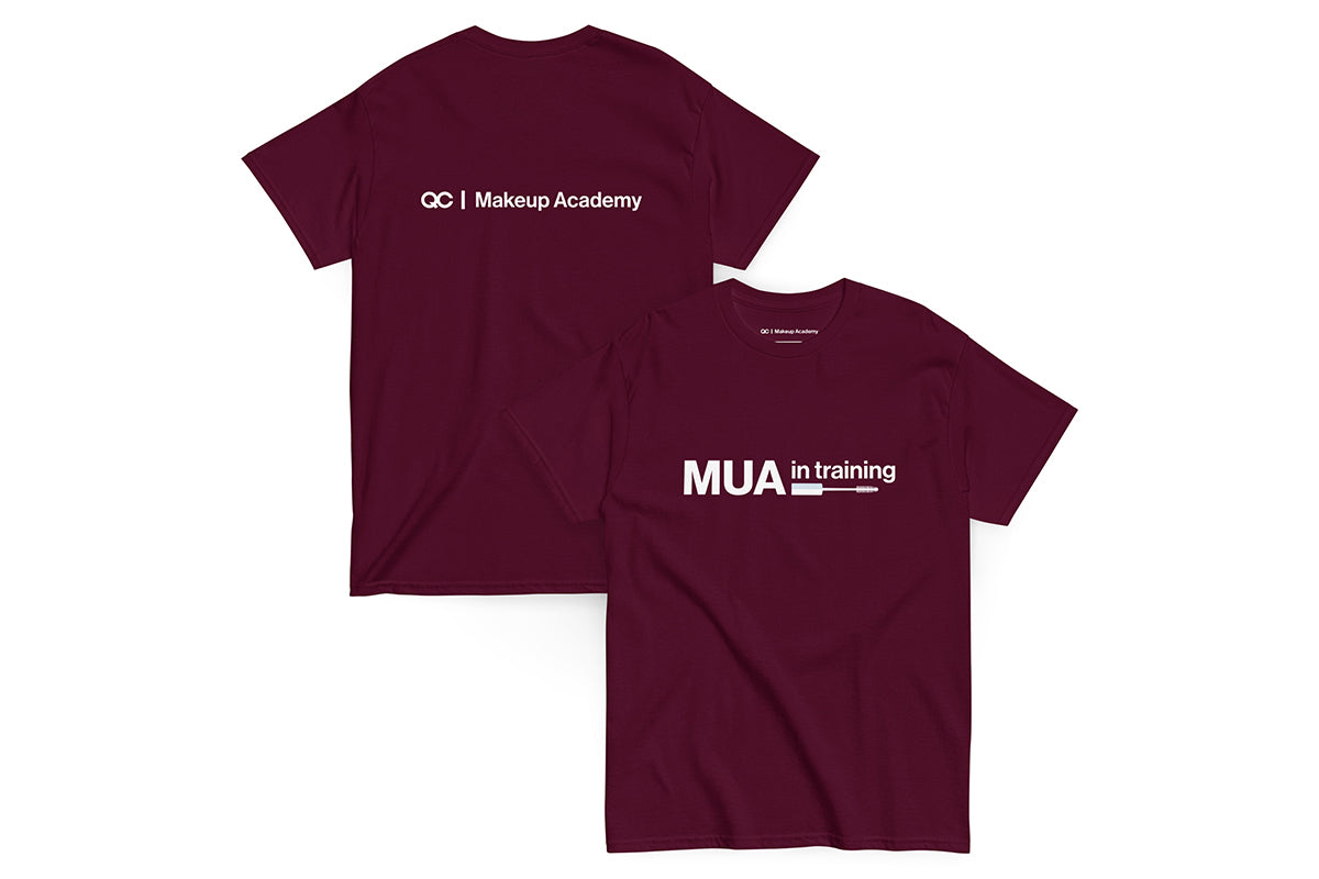 Maroon t-shirt with text 'MUA in Training' on a white background. Back of t-shirt reads "QC Makeup Academy".