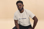 Man wearing a white t-shirt with a QC Pet Studies logo on a beige background
