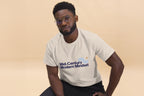 Person wearing a beige t-shirt with 'Mid-Century Modern Mindset' text on a beige background