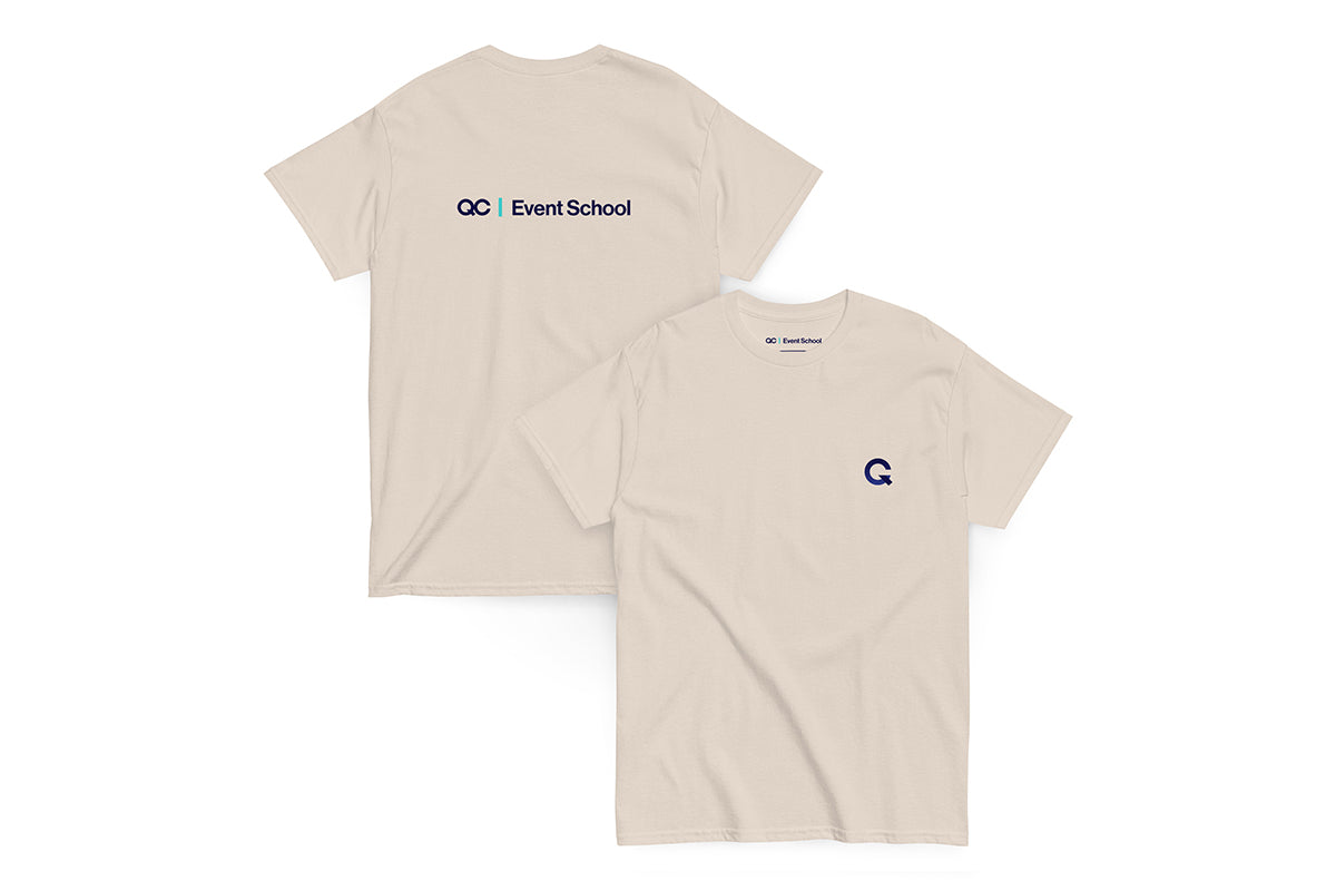 Back and front of a beige t-shirt. Back reads "QC Event School" and front features Q logo.