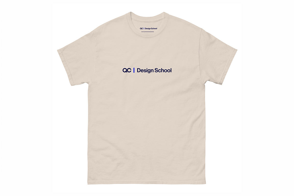Beige t-shirt with 'QC Design School' logo on a white background