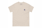 Beige t-shirt with a small Q logo on a white background
