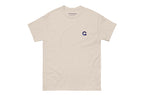 Beige t-shirt with a small Q logo on a white background