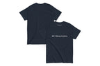 Front and back of a navy t shirt. The front reads "QC Makeup Academy"