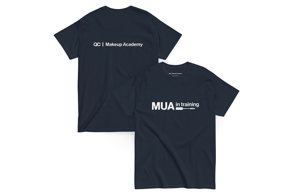 Navy t-shirt with text 'MUA in Training' on a white background. Back of t-shirt reads "QC Makeup Academy".