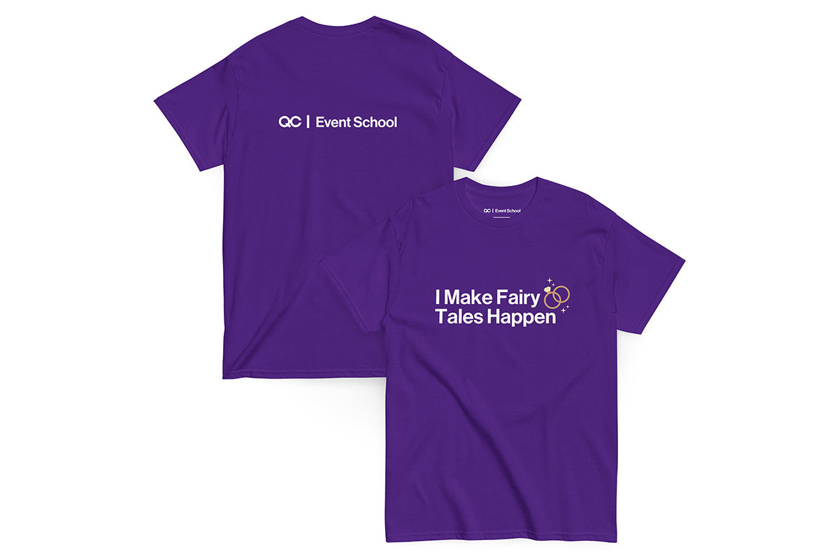 Purple t-shirt with text 'I Make Fairy Tales Happen' on a white background. Back of t-shirt reads "QC Event School".