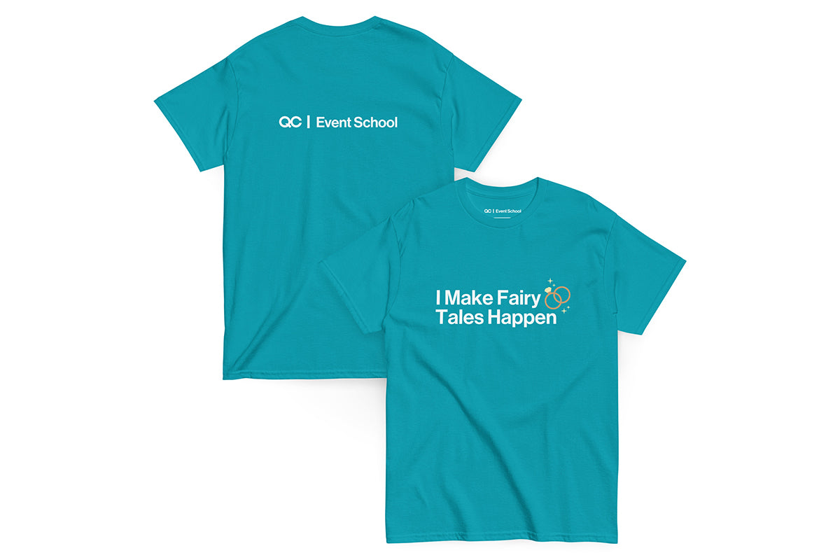 Teal t-shirt with text 'I Make Fairy Tales Happen' on a white background. Back of t-shirt reads "QC Event School".