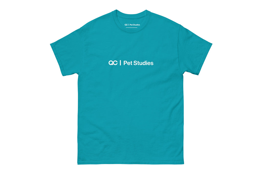 Blue t-shirt with 'QC Pet Studies' text on a white background
