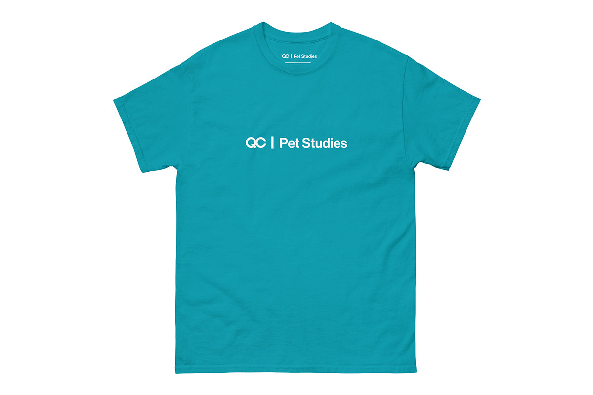 Blue t-shirt with 'QC Pet Studies' text on a white background