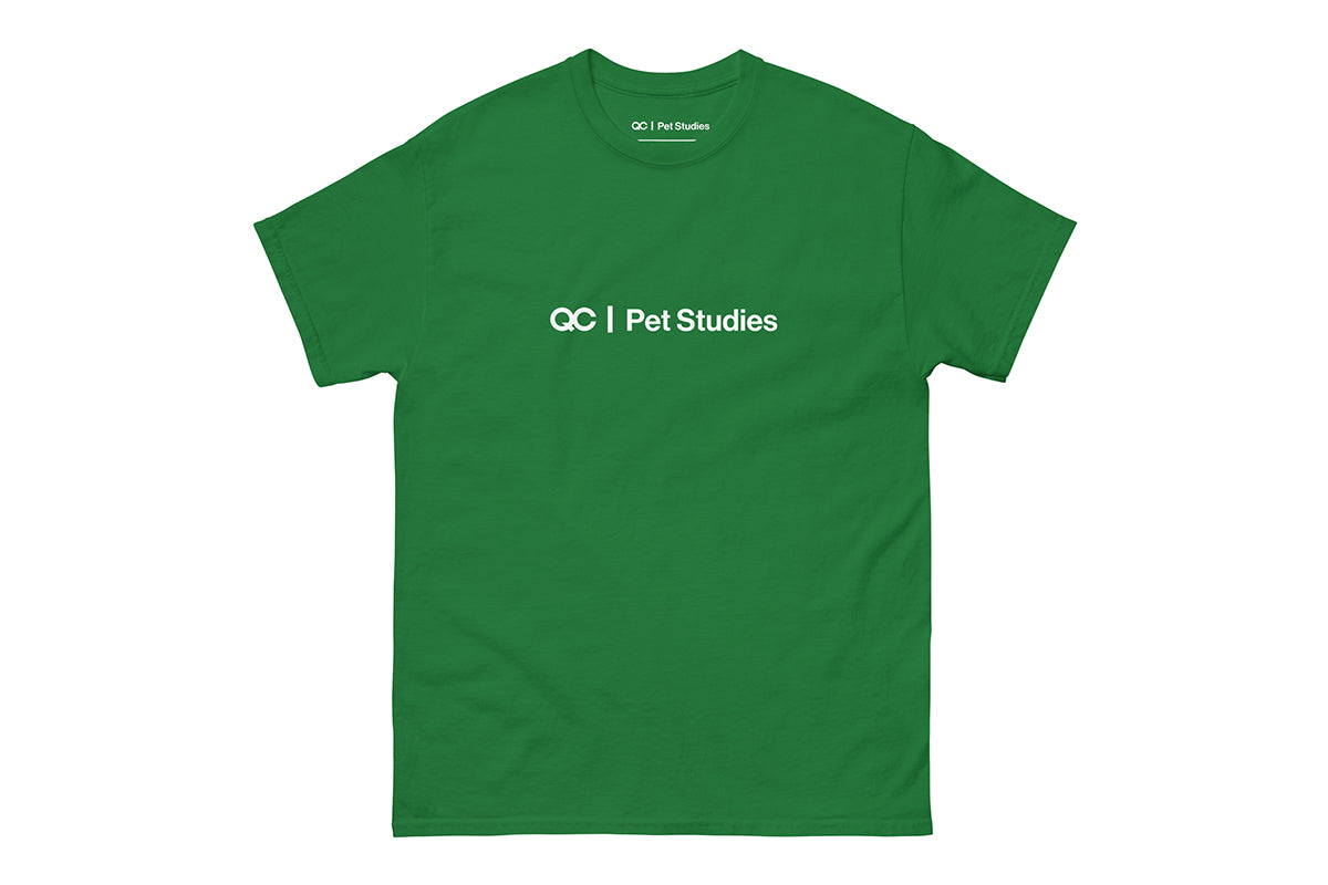 Green t-shirt with 'QC Pet Studies' text on a white background