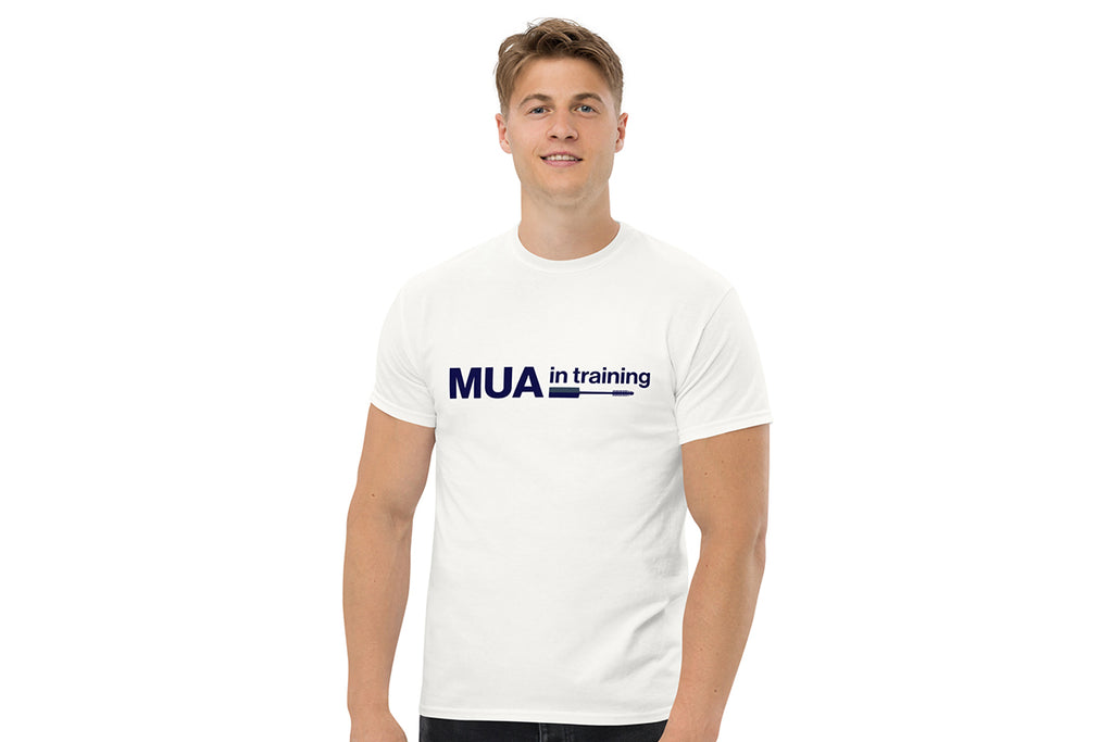 Person wearing a white t-shirt with 'MUA in training' text on a white background