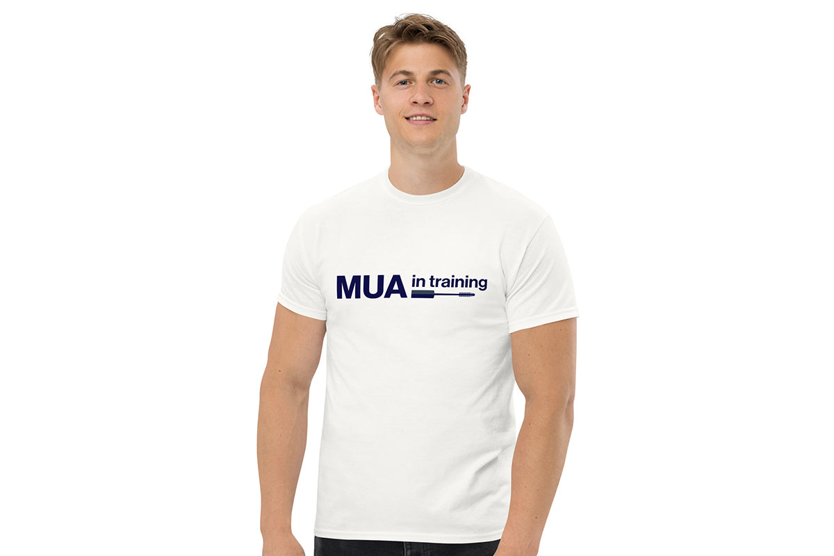 Person wearing a white t-shirt with 'MUA in training' text on a white background