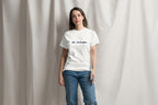 Person wearing a white t-shirt with QC Pet Studies on a plain background