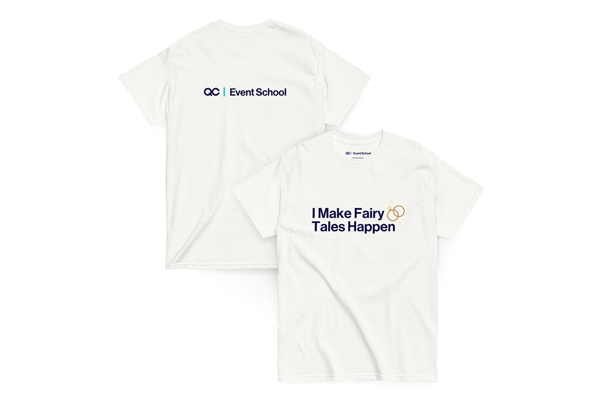 Back and front of white t-shirt. Back reads "QC Event School". Front reads "I Make Fairy Tales Happen"